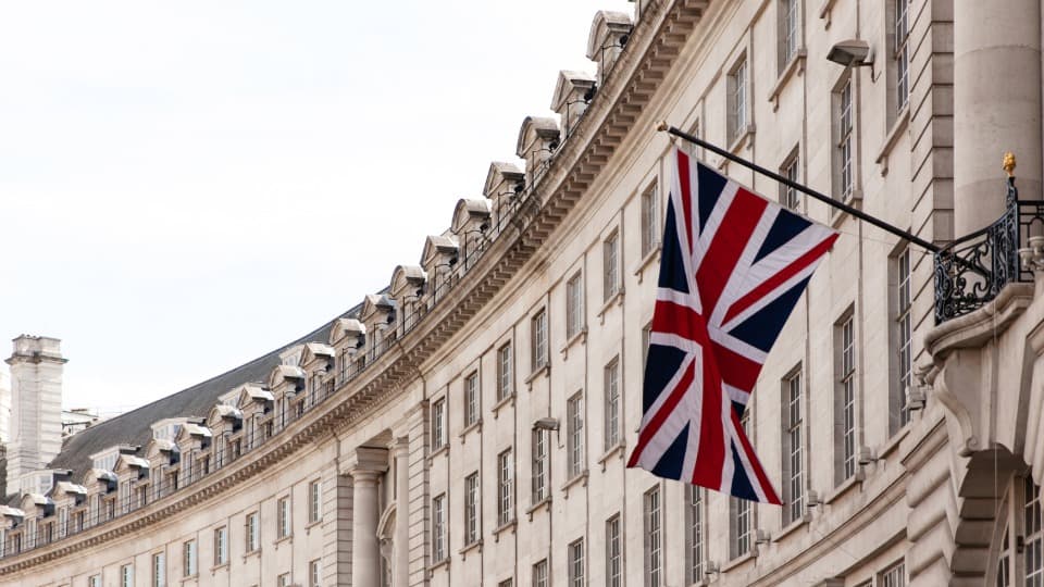 United Kingdom flag on historic building facade in London