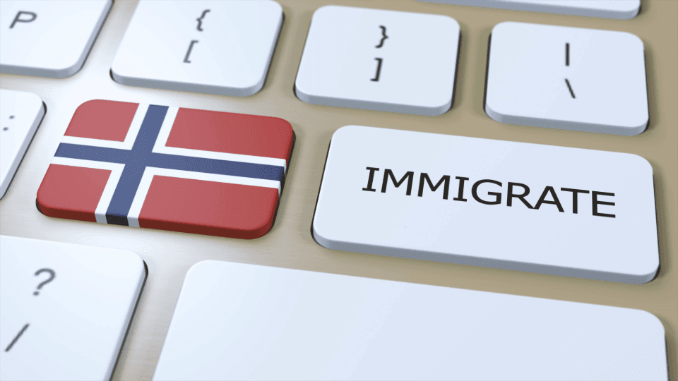 Keyboard with Norwegian flag key and IMMIGRATE key as a symbol of immigration to Norway
