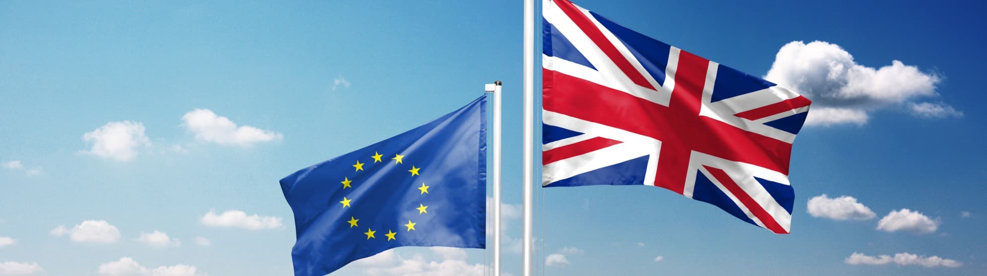 EU and UK flags in the sky – symbol for entry requirements and United Kingdom visa